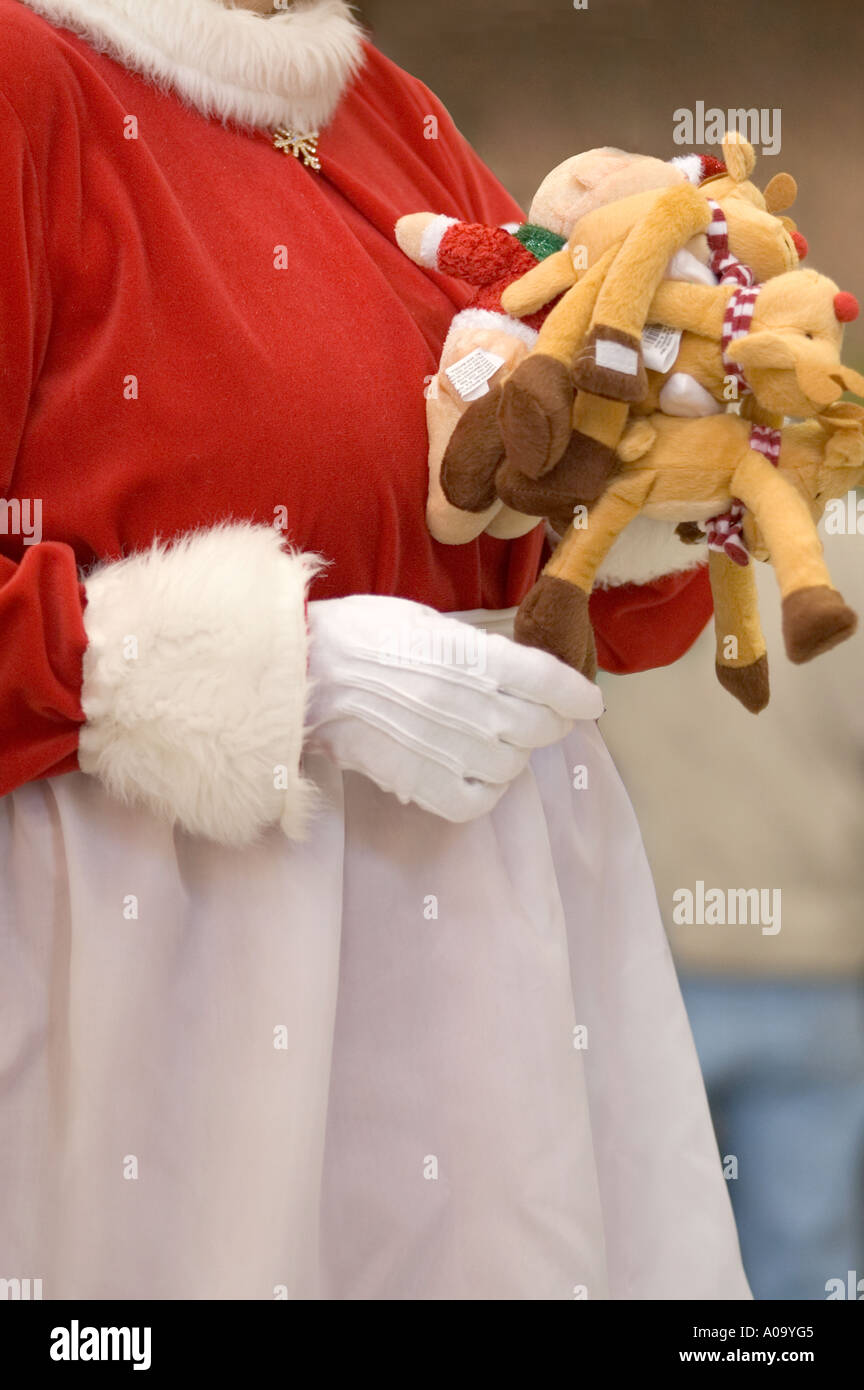 Partial view of Mrs Santa Claus holding stuffed toys Stock Photo - Alamy