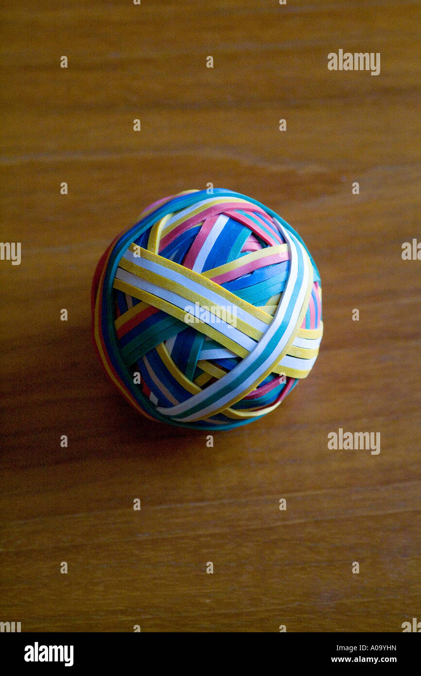 A multicoloured rubber band ball on a desk Stock Photo Alamy