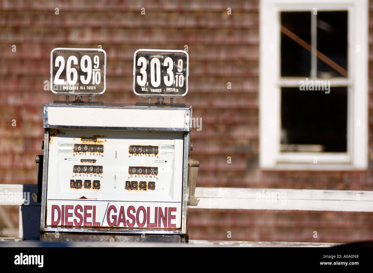 Modern gas prices on display at an old style gas pump in Castine Maine August 2005 Stock Photo