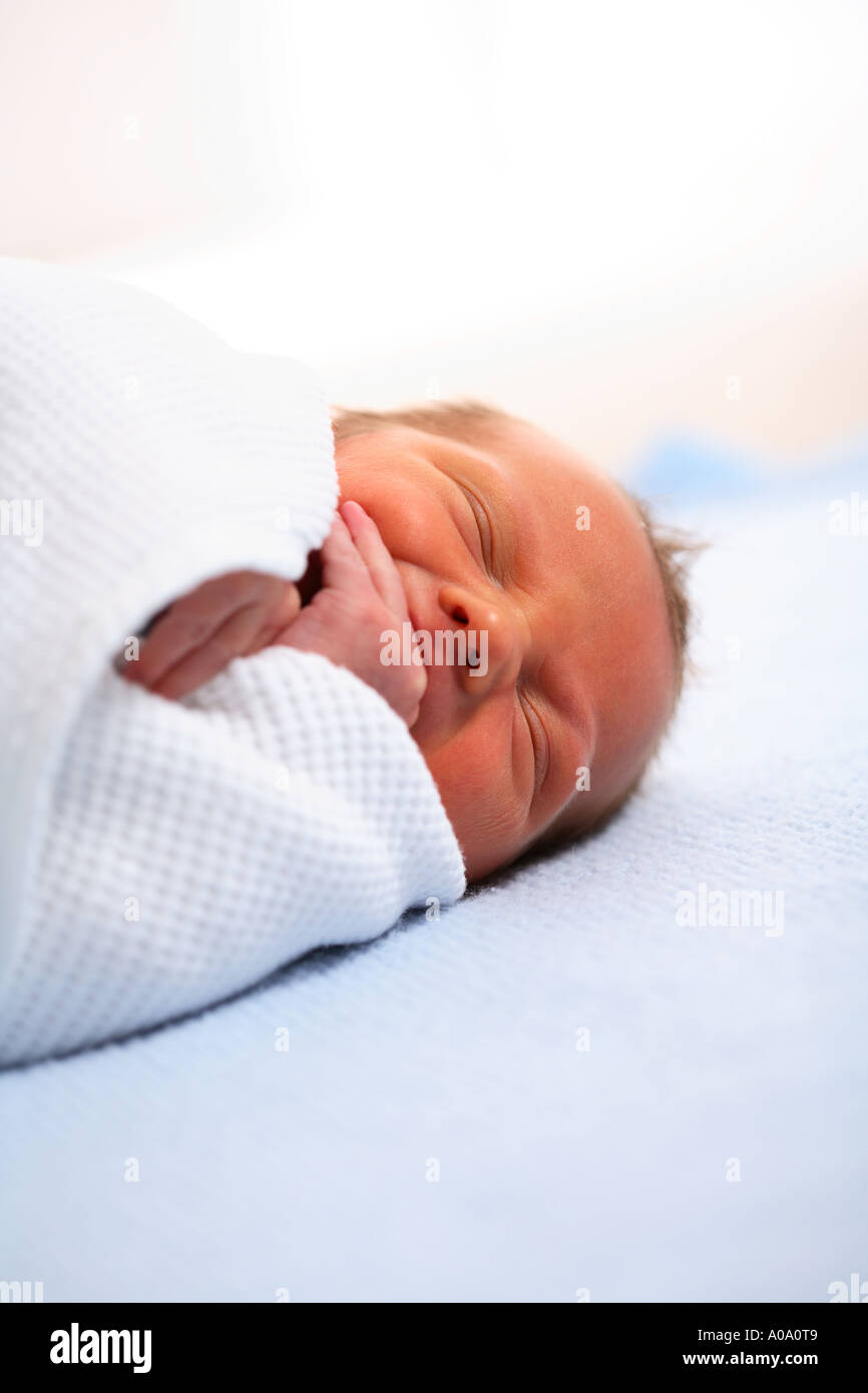 Newborn baby sleeping in blanket Stock Photo Alamy