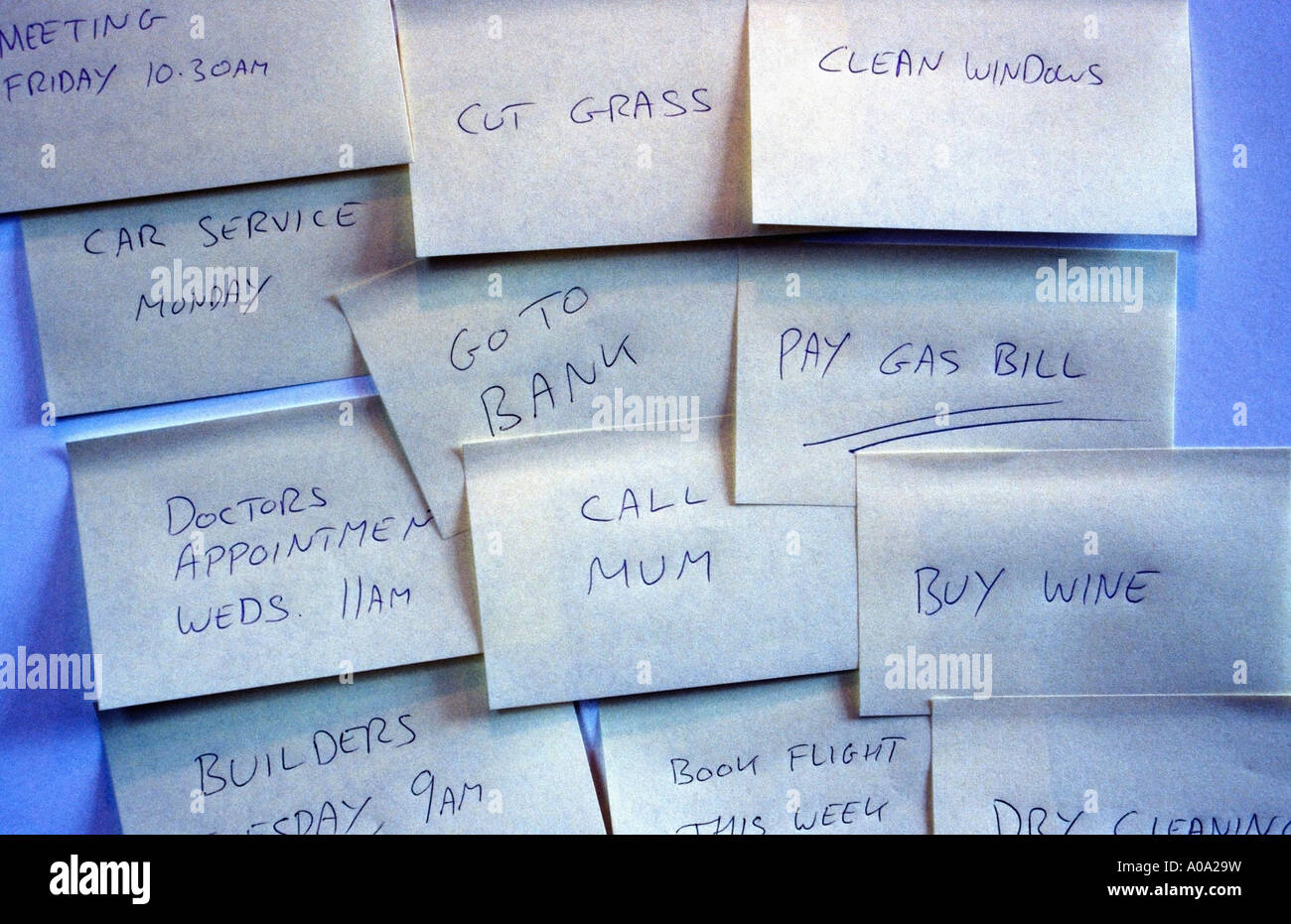 Multiple to-do notes stuck to a door / wall Stock Photo