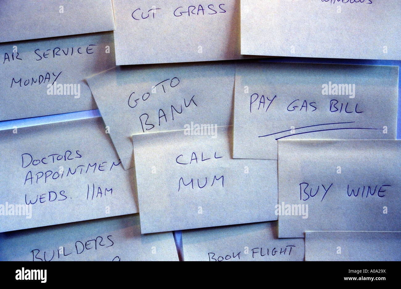 Multiple to-do notes stuck to a door / wall Stock Photo