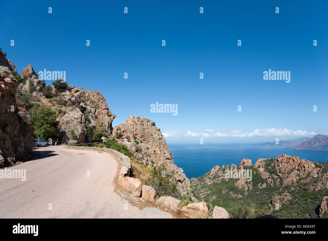 Coast road through Les Roches Rouges (Red Rocks) between Piana and Porto, Gulf of Porto, Corsica, France Stock Photo