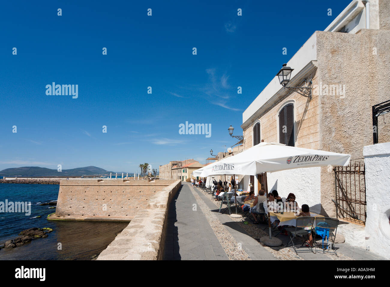 Seafront Restaurant on the walls of the Old Town, Alghero, Sardinia, Italy Stock Photo