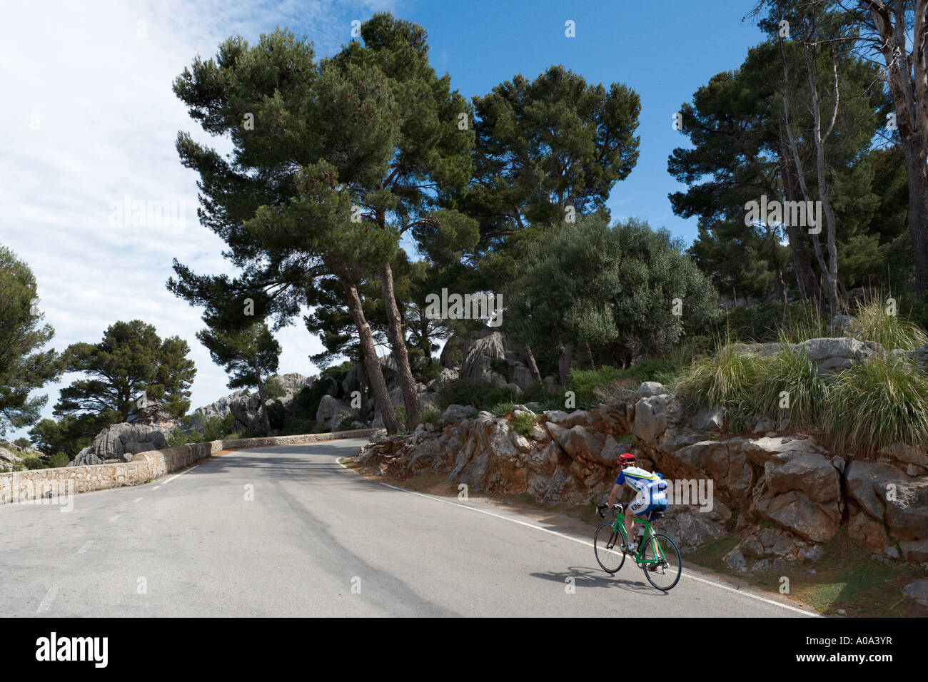 Cyclist on a mountain road near Sa Calobra in the winter season, Mallorca, Balearic Islands, Spain Stock Photo