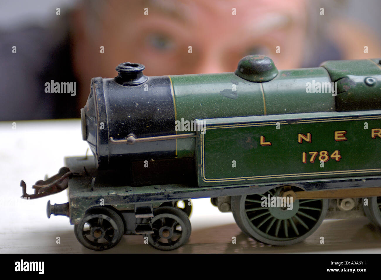 Lifestyle Concept image adult male looking at classic electric toy