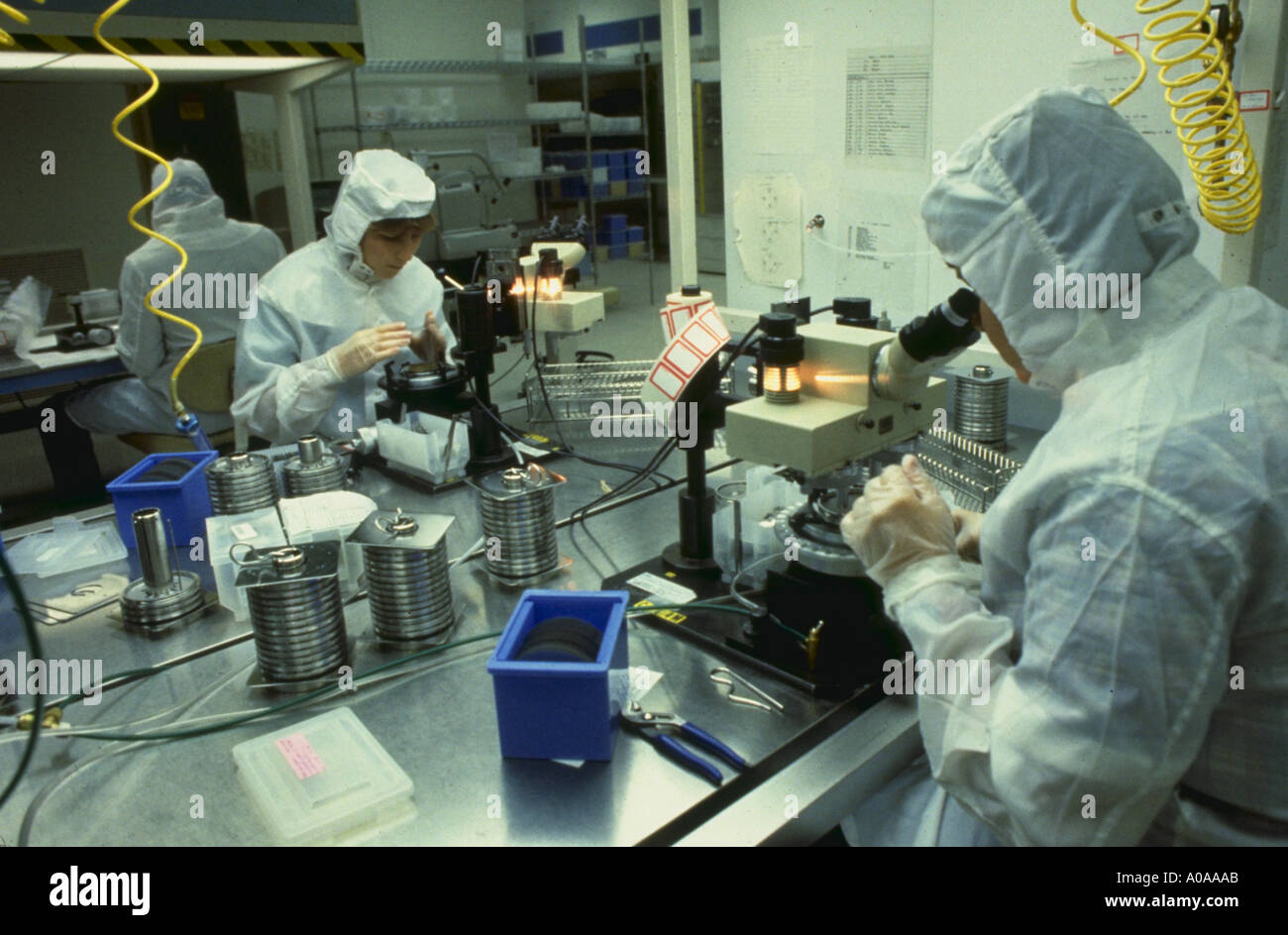 Workers In Clean Room Checking Computer Chips During The