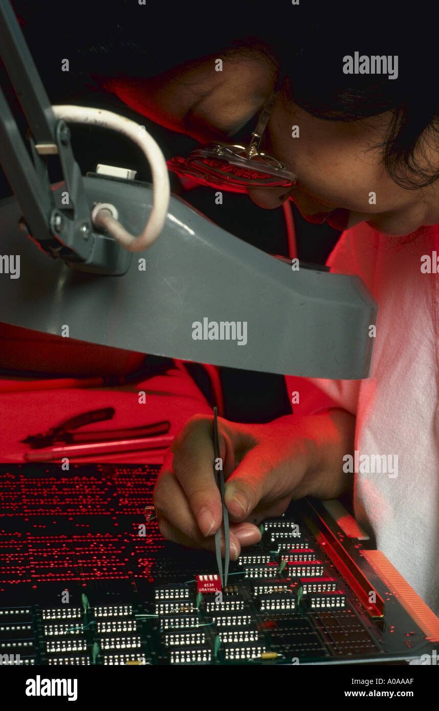 Technician works on computer boards at Point Four Company in California Stock Photo