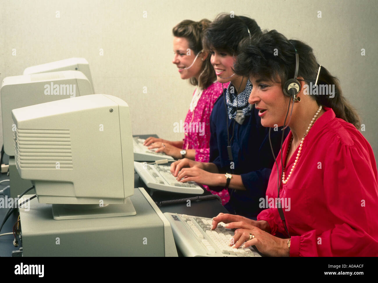 Women in front of computers telemarketing Stock Photo - Alamy