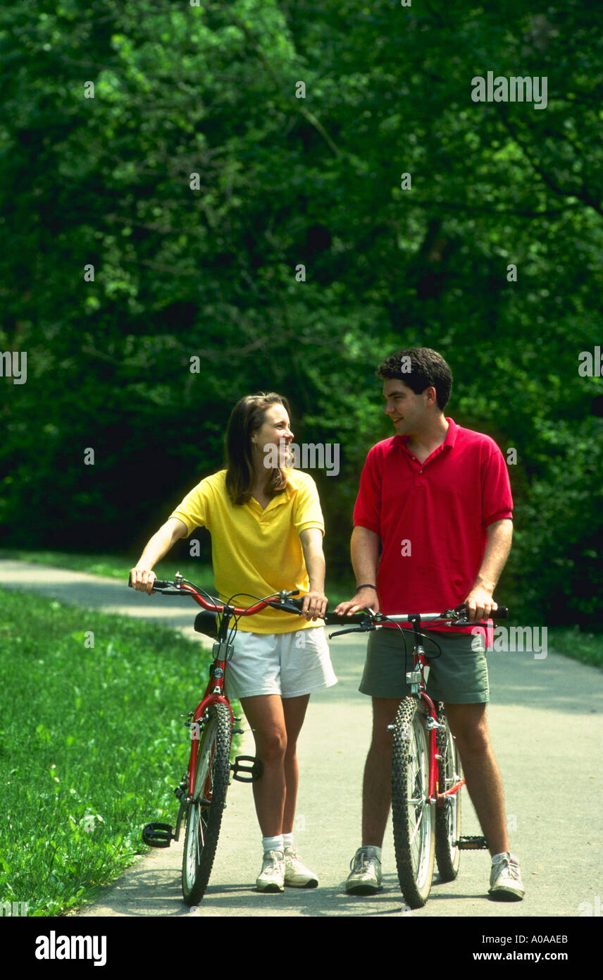 Couple riding bikes in woods Bethesda Maryland model released Stock Photo
