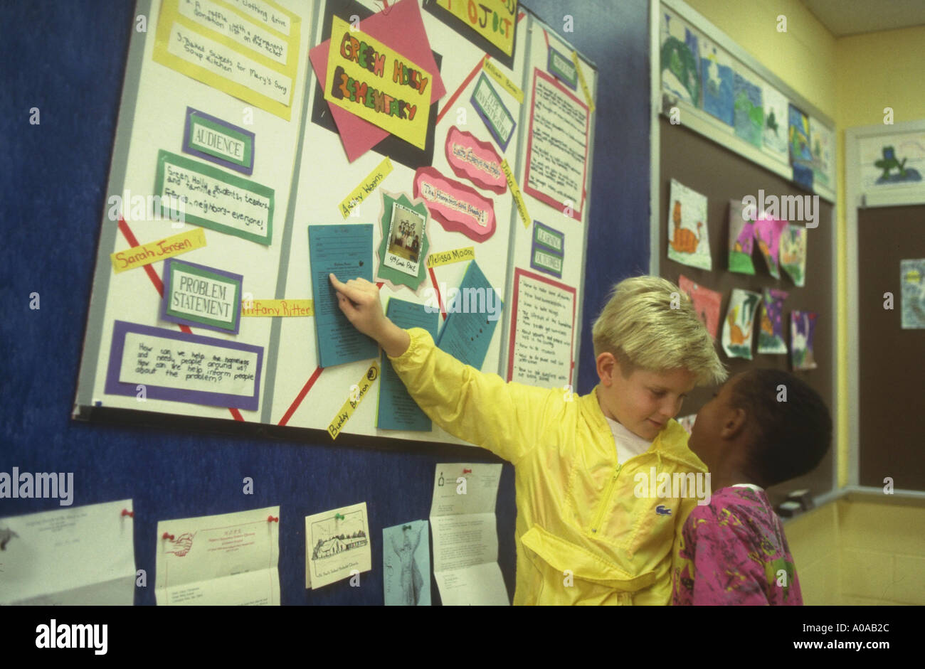 Two elementary students discuss homelessness project model released Stock Photo