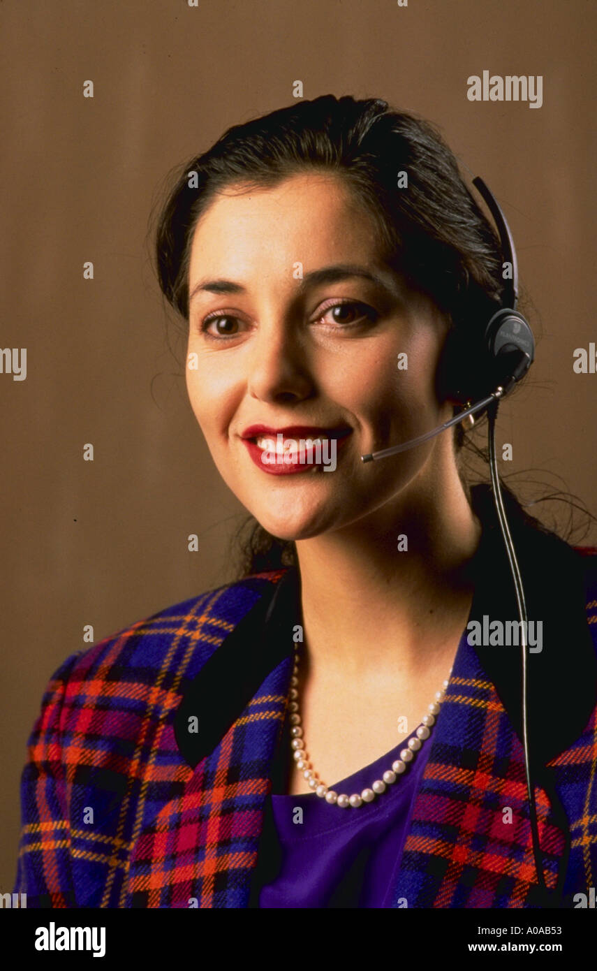 Telephone operator woman with headset Stock Photo