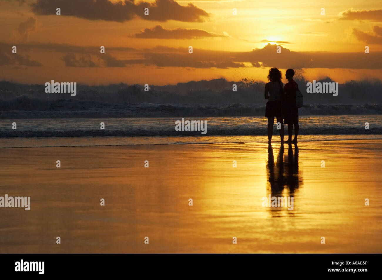 Couple Looking At Sunset , Bali Stock Photo