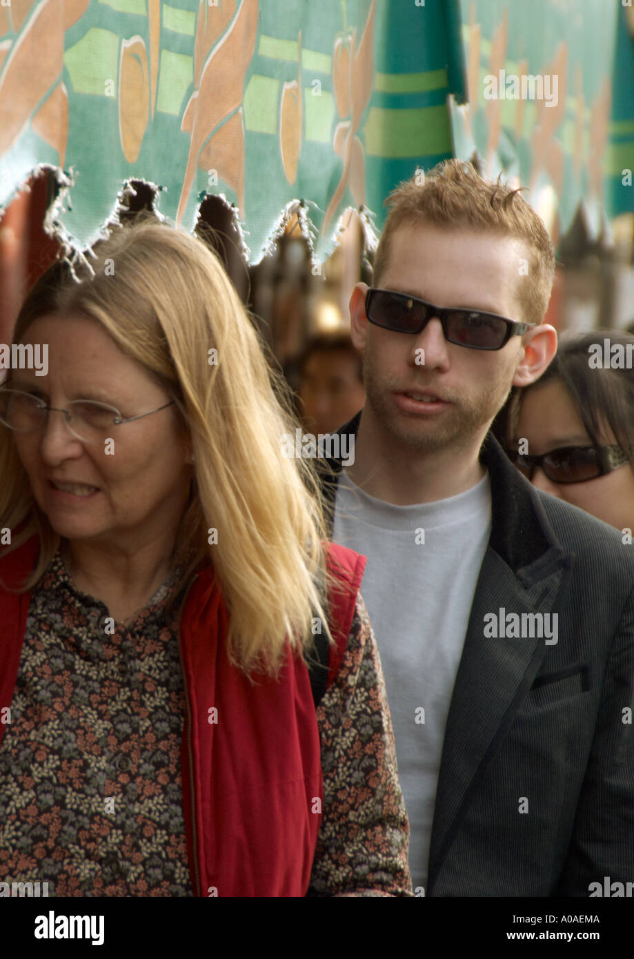 Male female talking crowded street hi-res stock photography and images ...