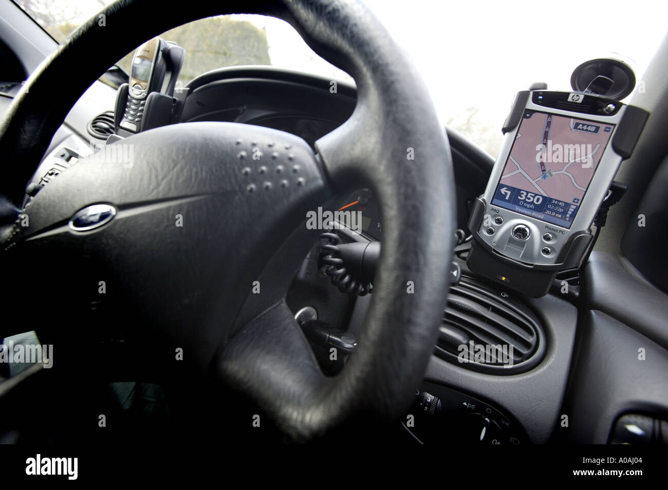 A Pocket PC GPS system mounted in a car Stock Photo