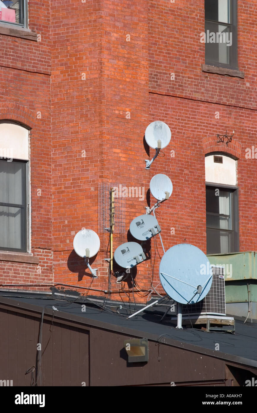 Satellite dishes on a building rooftop Stock Photo Alamy