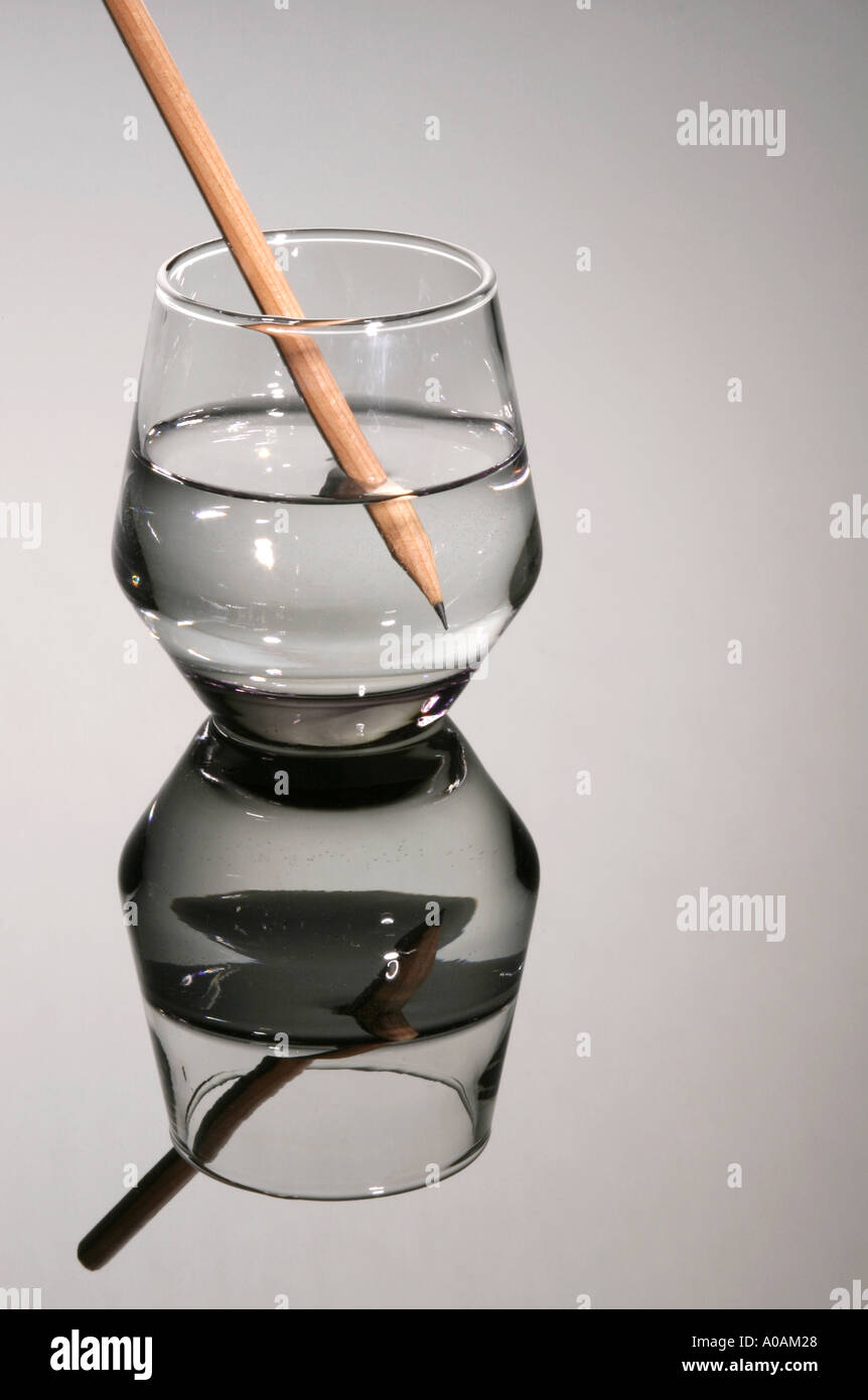 A pencil in a glass of water Stock Photo - Alamy