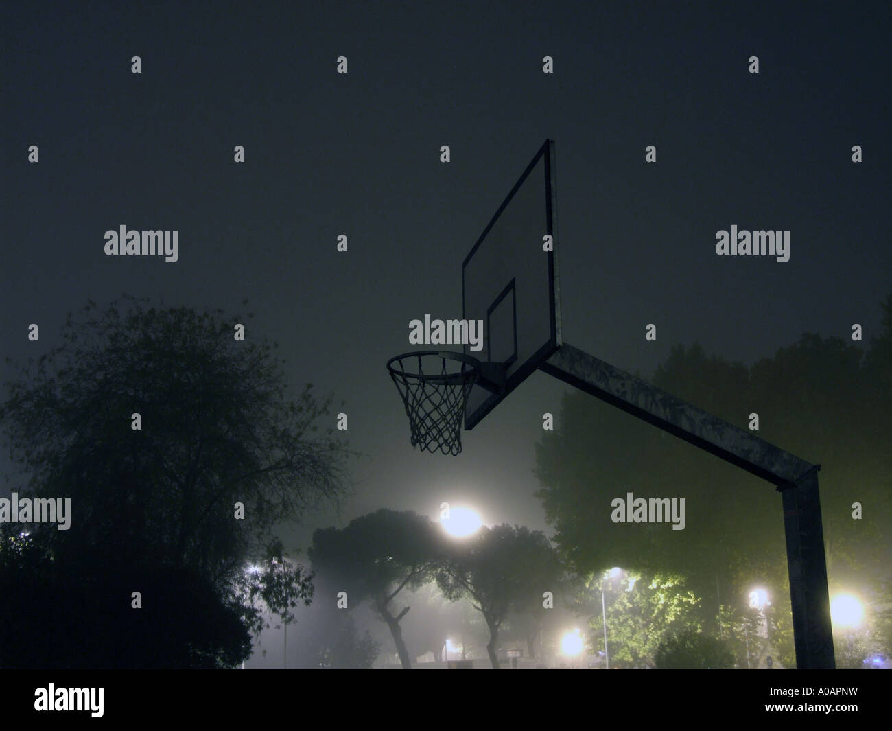 basketball court at night in thick fog Stock Photo Alamy