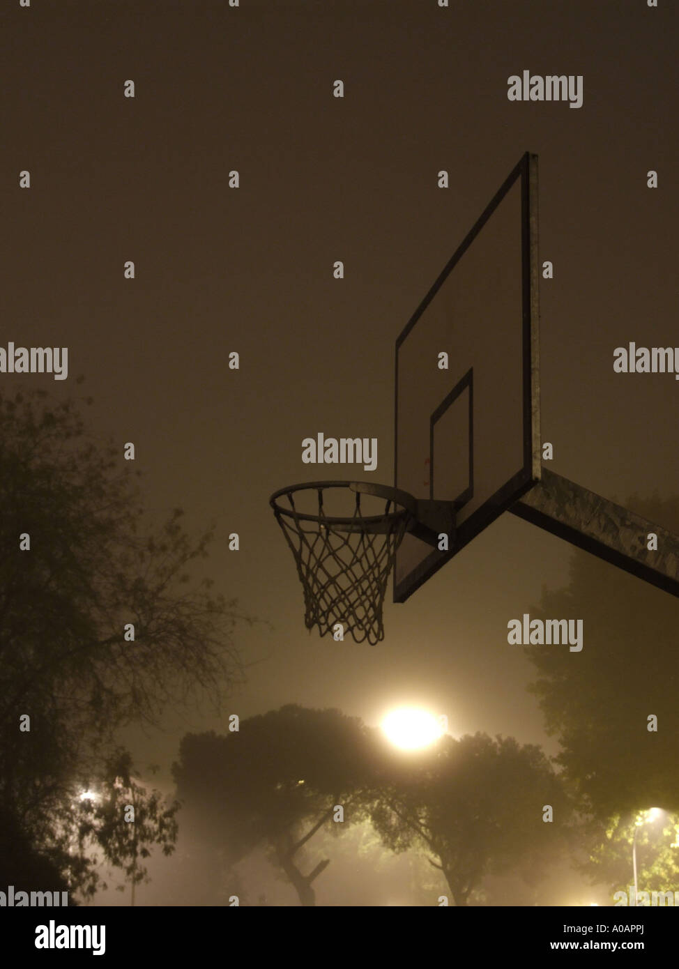 basketball court at night in thick fog Stock Photo Alamy