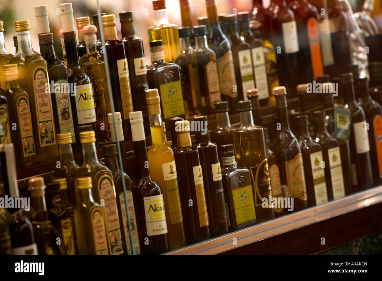 olive oil bottles in shop window Stock Photo Alamy
