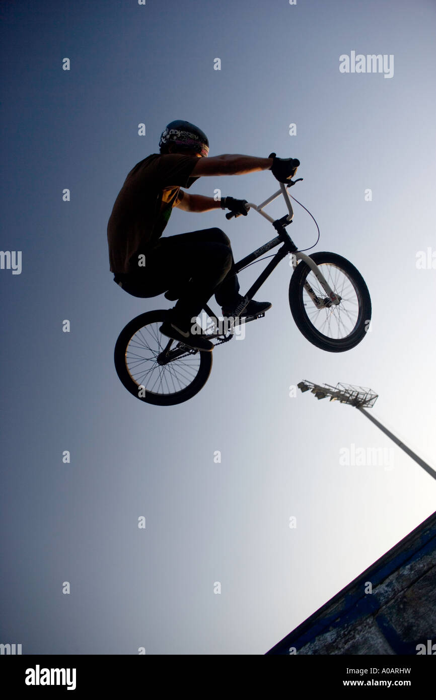 BMX stunt rider in mid air Stock Photo