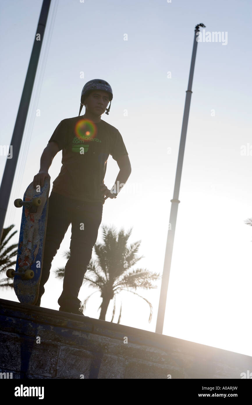 Skateboarder on edge of ramp Stock Photo - Alamy