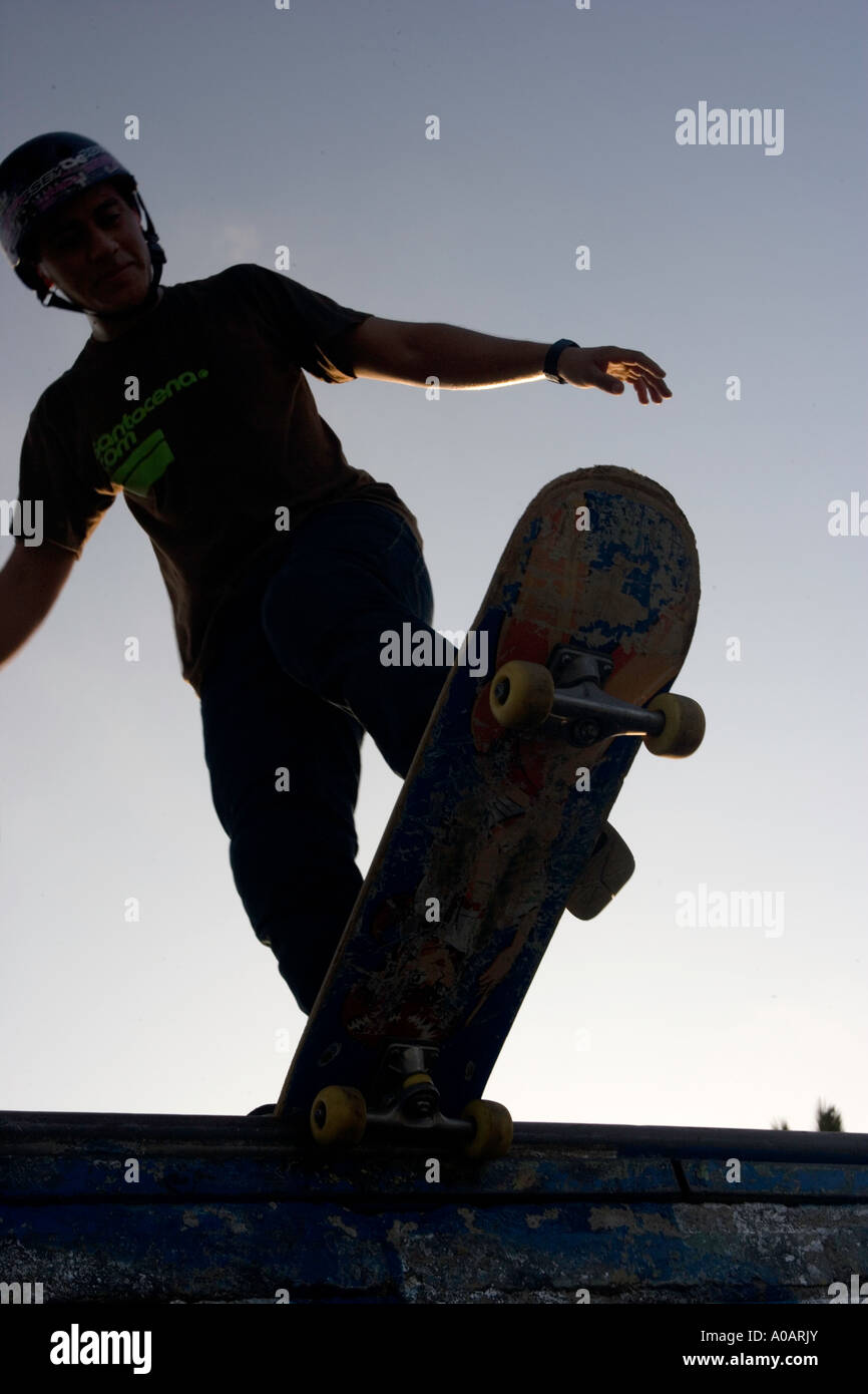 Skateboarder on edge of ramp Stock Photo - Alamy