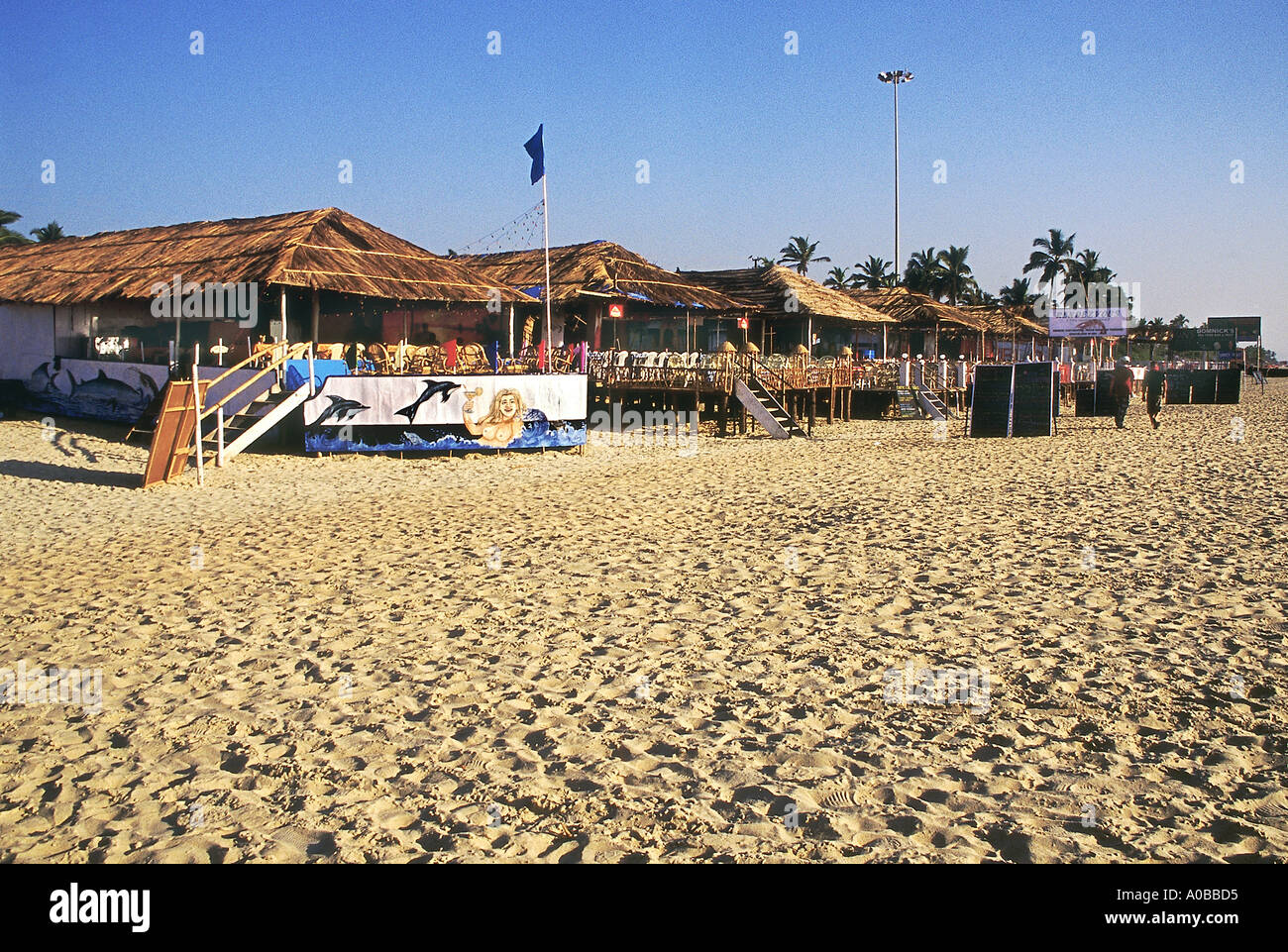 Thatch roof restaurants on Majorda Beach. Goa, India. Stock Photo