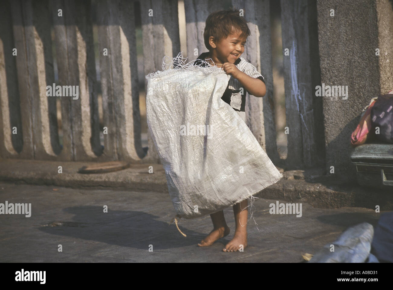 A little rag picker with his sack Stock Photo