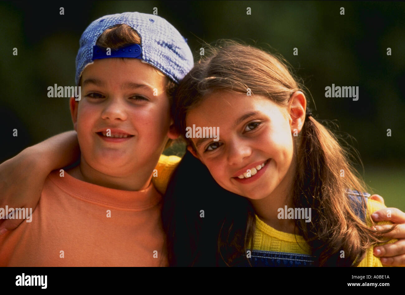 Boy And Girl With Arms Around Eachother Smiling Stock Photo Alamy