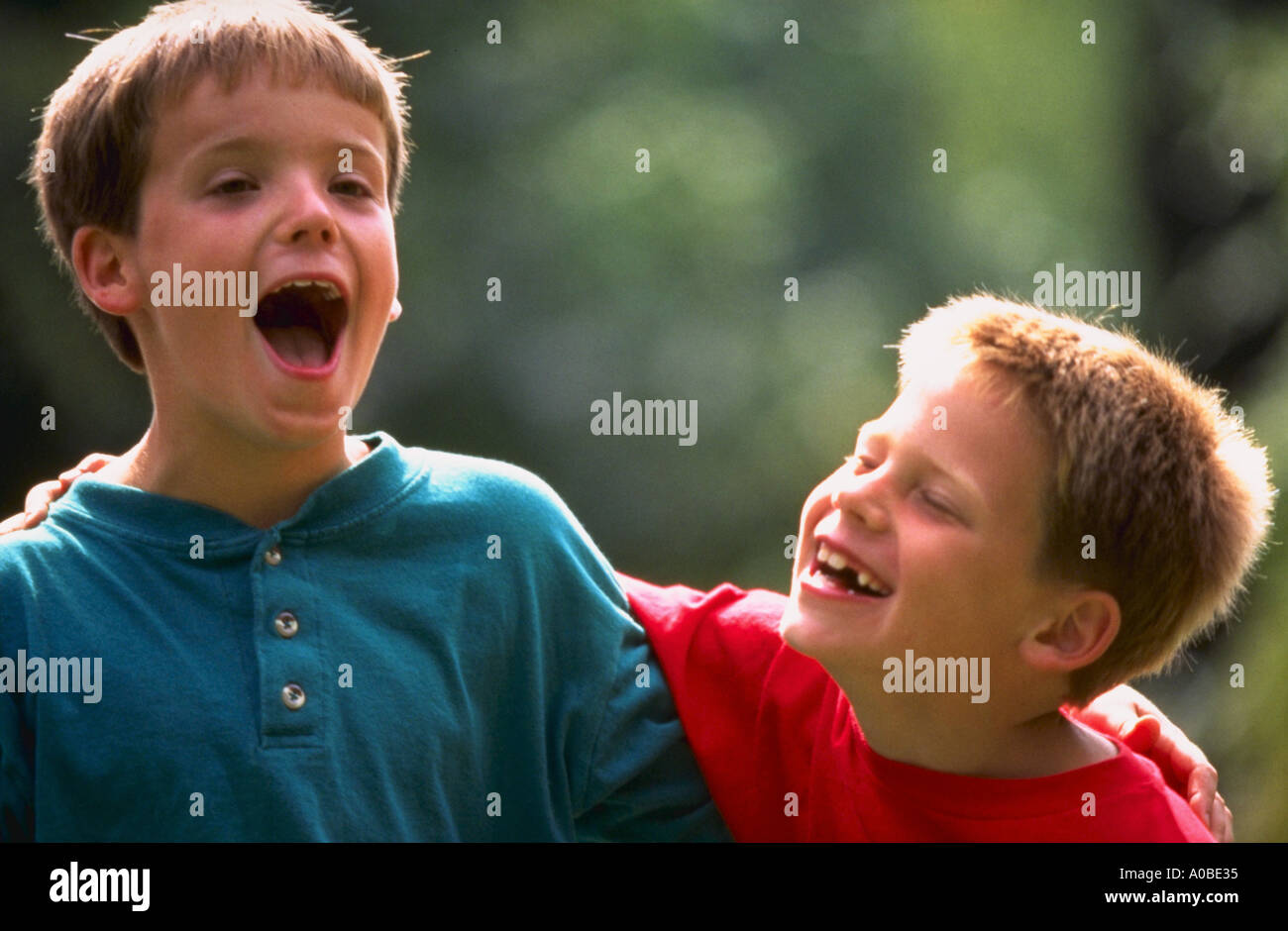 Two boys laughing and smiling together Stock Photo