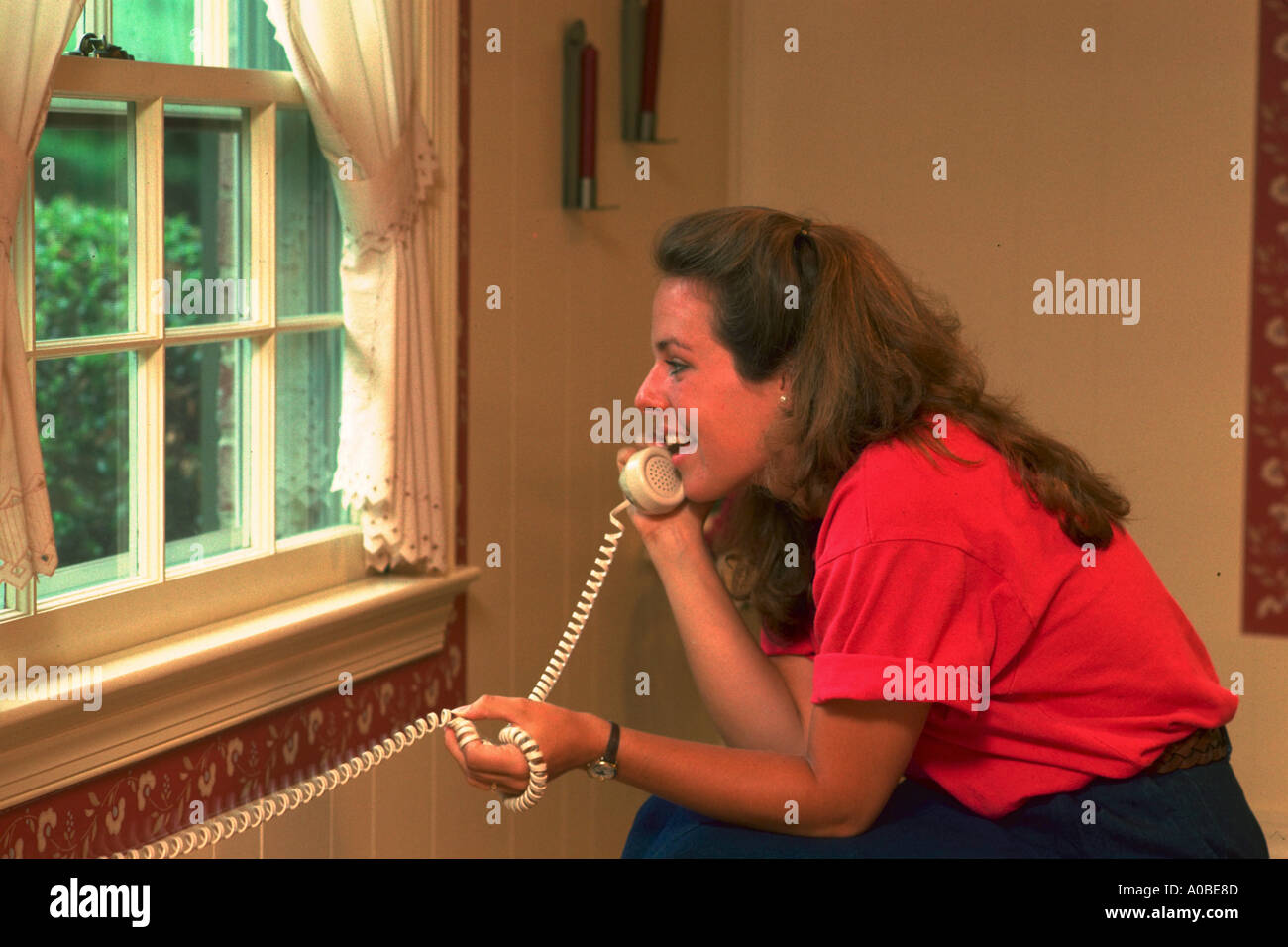 High school girl on telephone at home Stock Photo