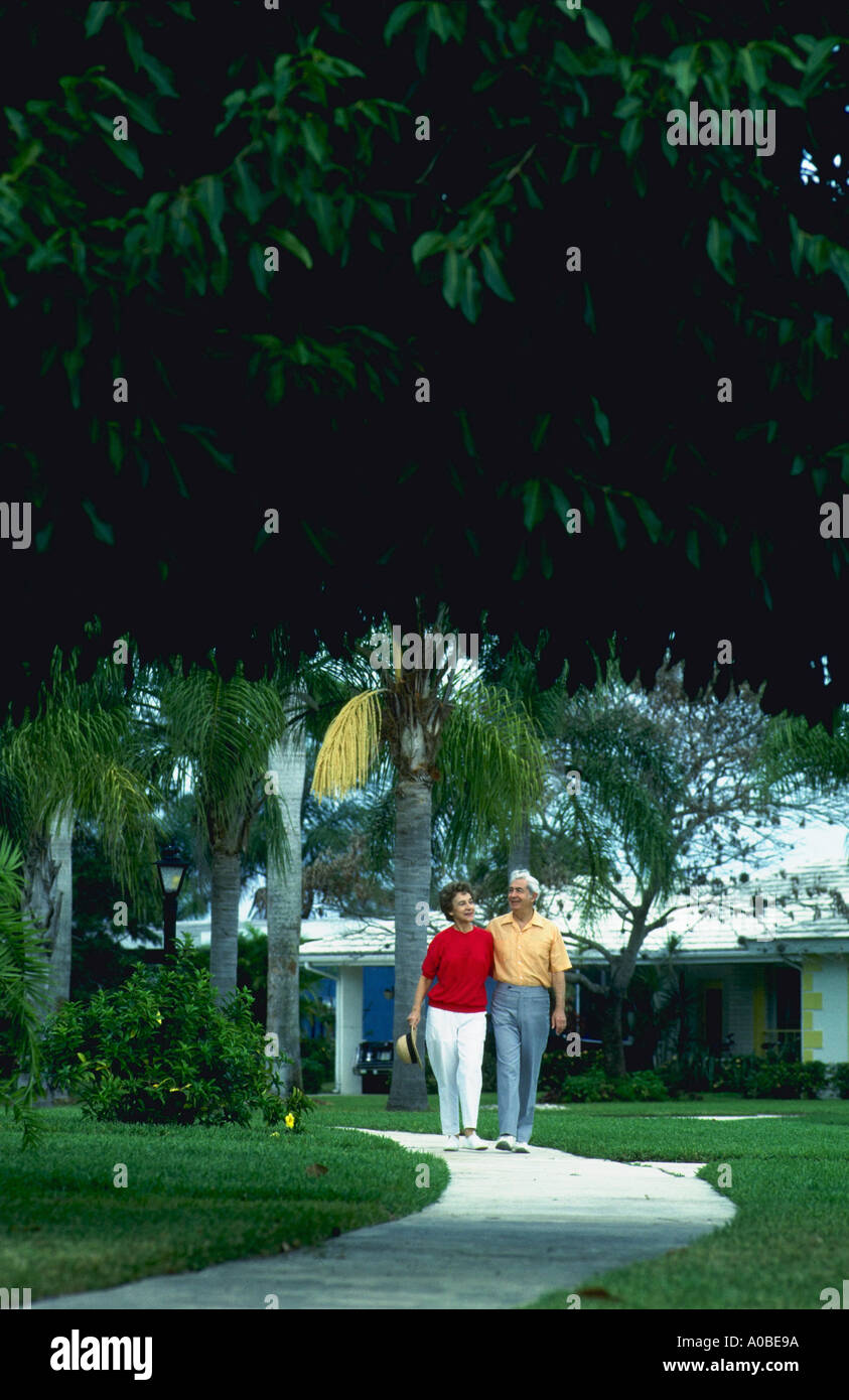 Retired couple walking at Port St Lucie Florida Stock Photo