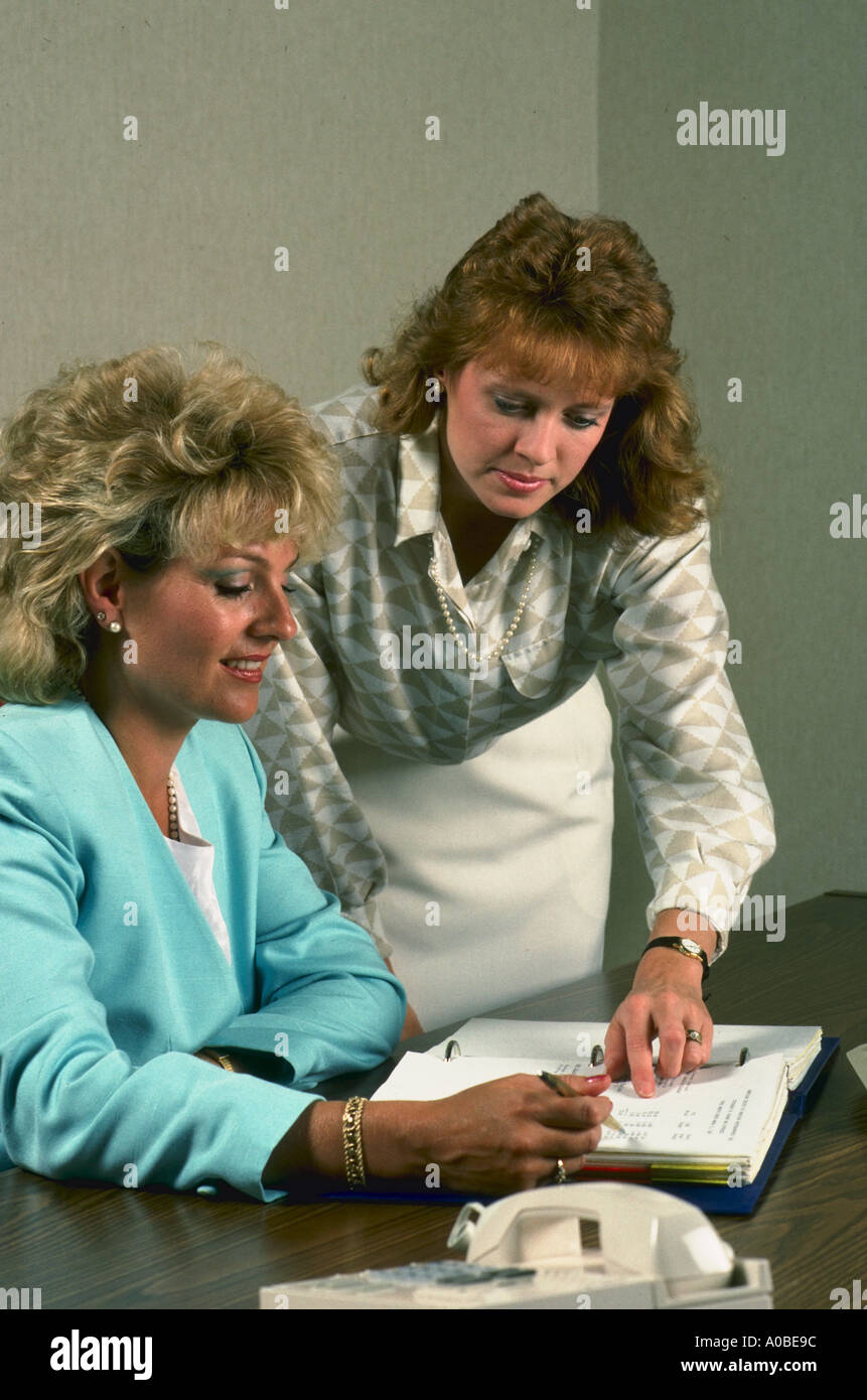 Woman executive talking with assistant in office Stock Photo