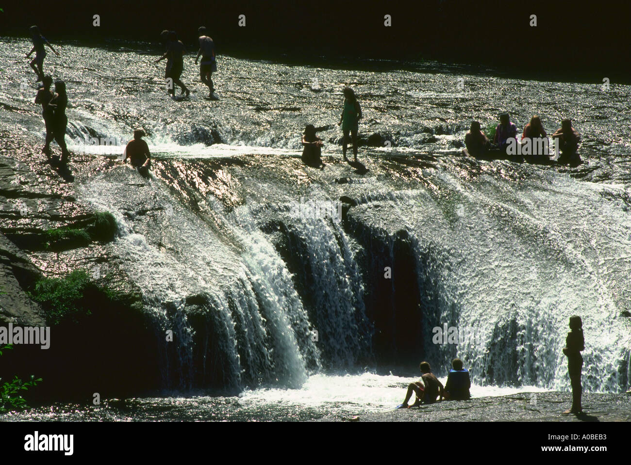 People swimming at South Umpqua falls in Oregon Stock Photo