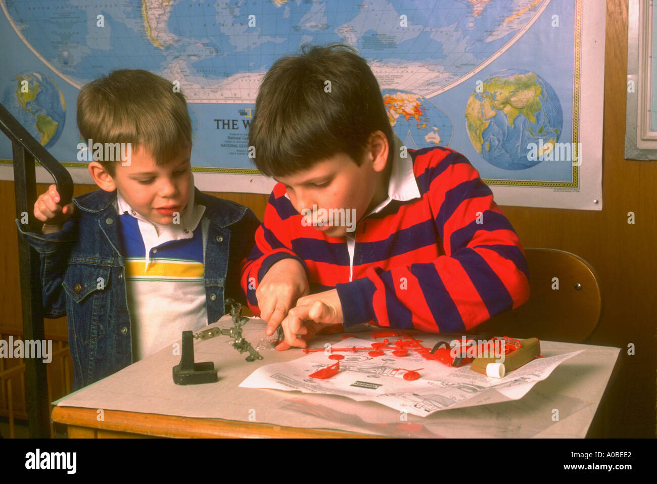 Two boys build model together Part of a series on home schooling Also see JHP1007 Stock Photo