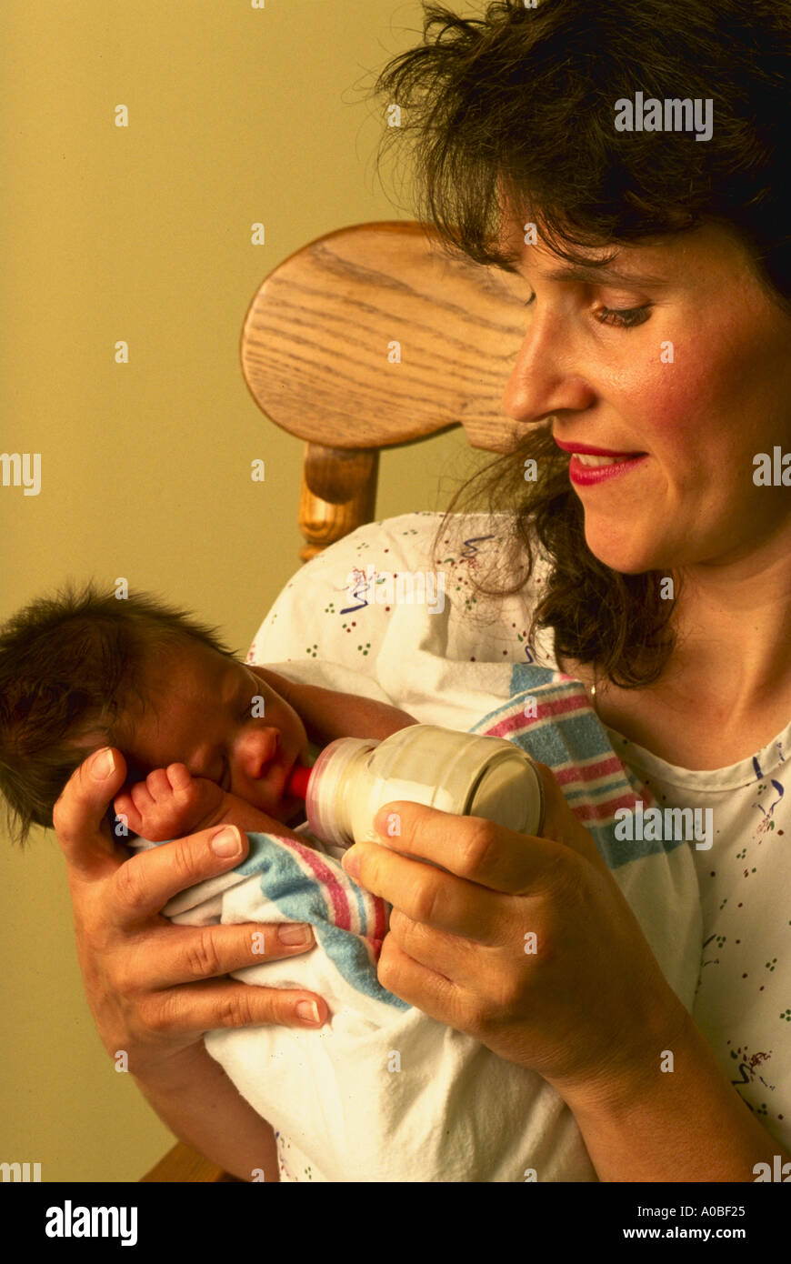 Nurse feeding premature baby in nursery Flagler Hospital Florida model released Stock Photo