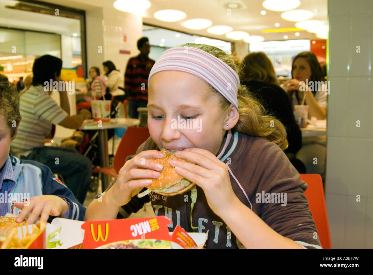 Young child eating fast food mcdonalds hires stock photography and images Alamy