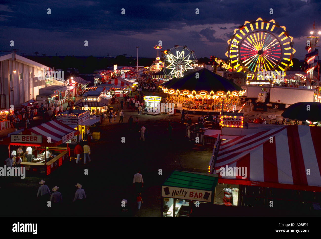 Carnival rides at twilight at Cheyenne Frontier Days in Cheyenne WY CF65698 Stock Photo