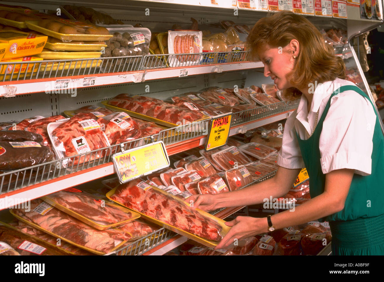 Woman buys meat at supermarket released CF26336 Stock Photo