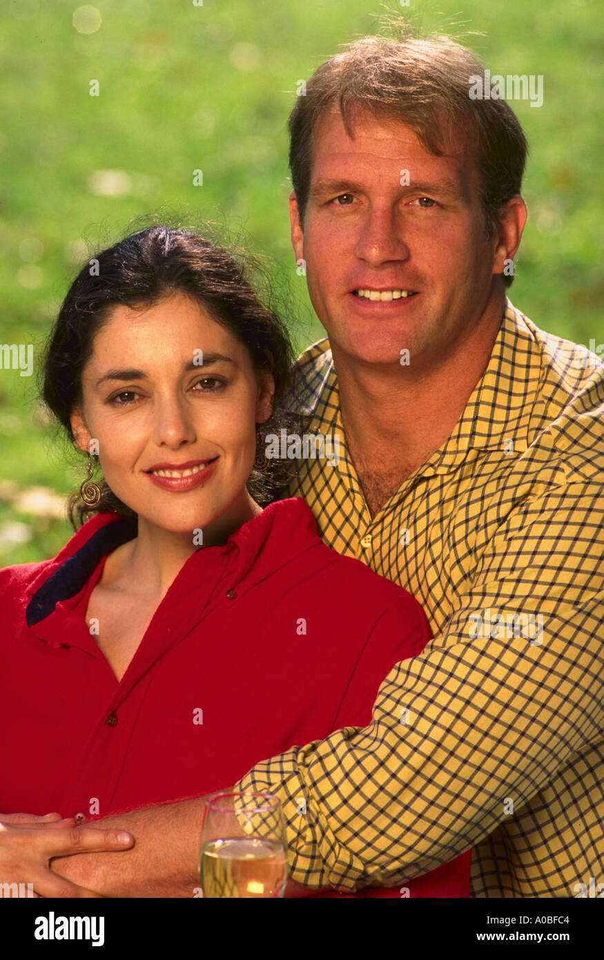 Portrait of young couple in park Stock Photo