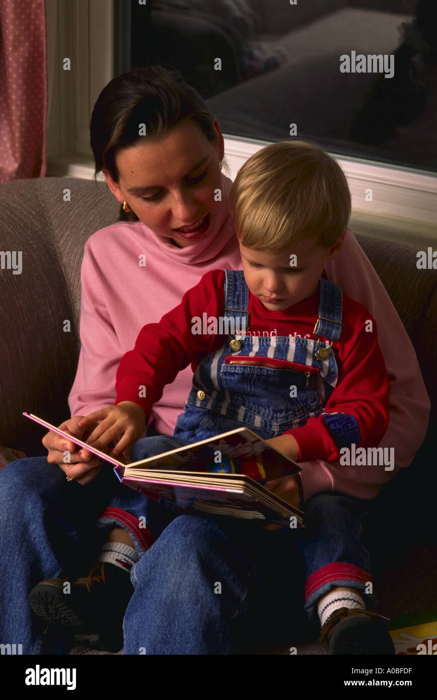 Mother reads to child at home Stock Photo