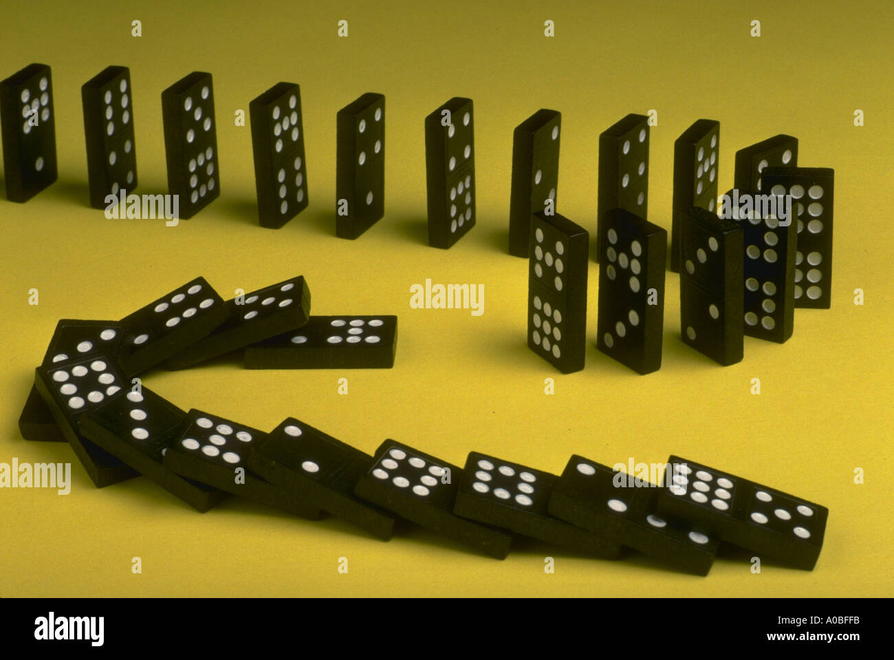 Breaking the chain of cause effect missing link of dominoes Stock Photo