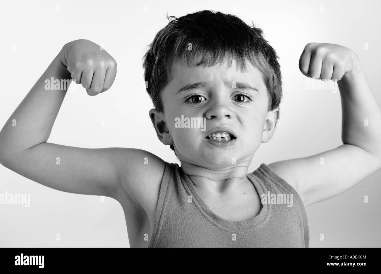 child pretending to be strong man Stock Photo - Alamy