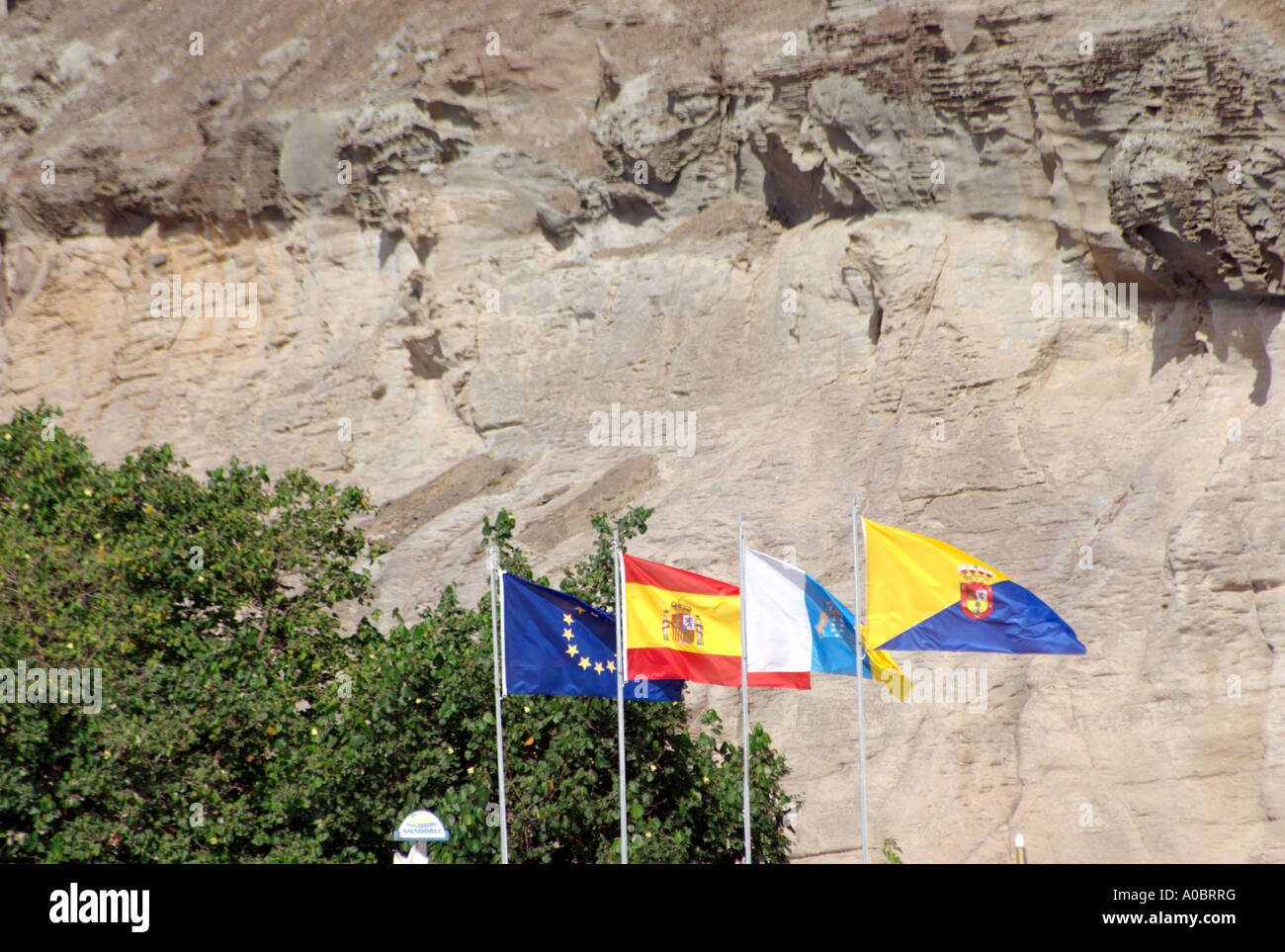 Four flags from left to right European Union Spain The Canary Islands and Gran Canaria This means breaking it down to details Sp Stock Photo