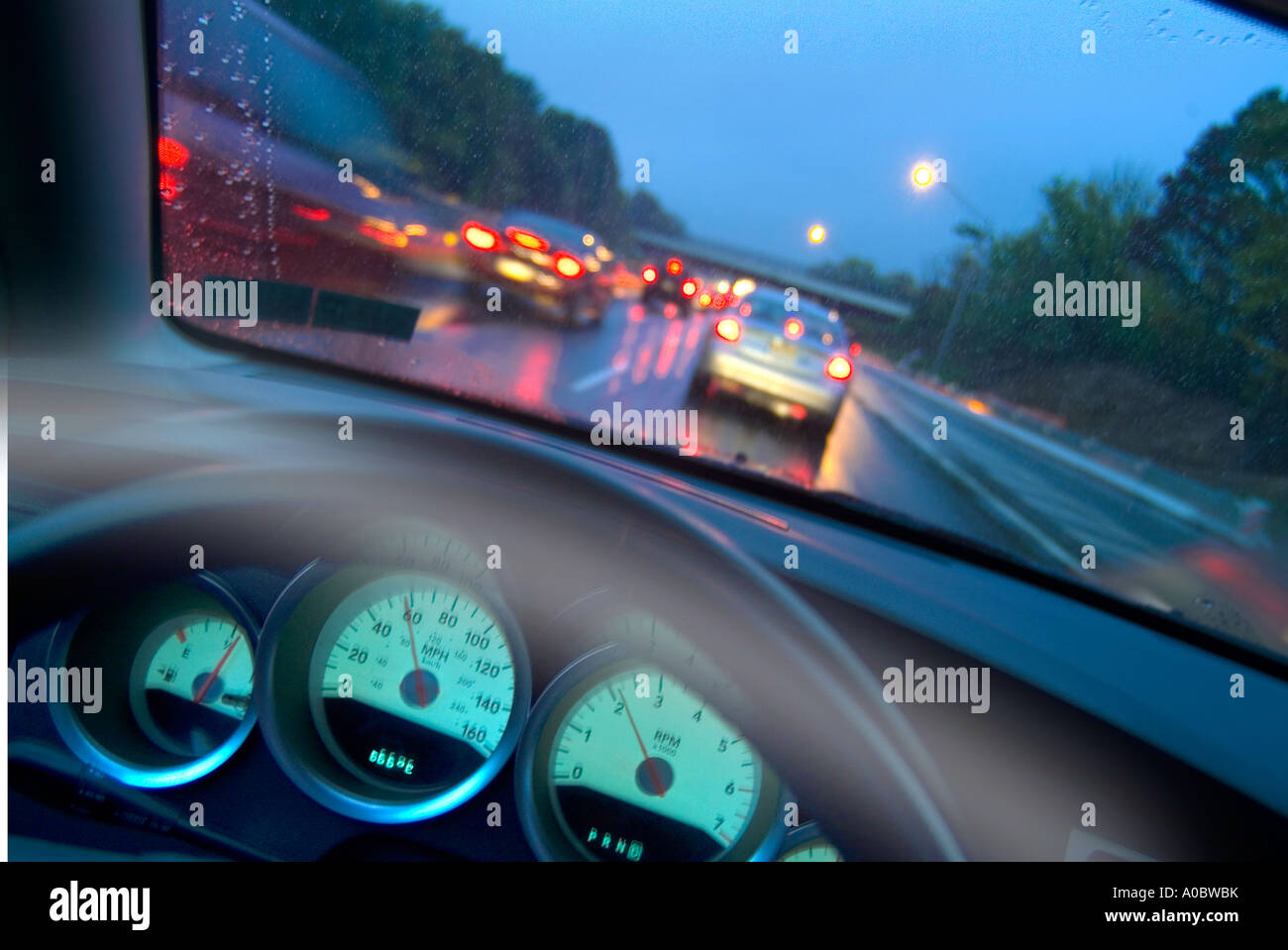 View Of Cars On Highway From Drivers Perspective With Steering Wheel, Dashboard  And Motion Blur, Philadelphia, PA USA Stock Photo