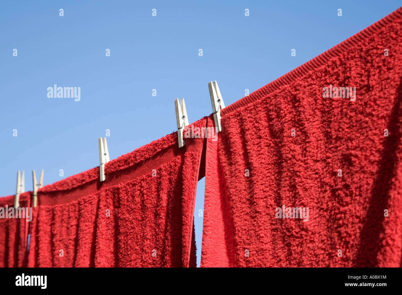 Red towels on a clothesline Stock Photo