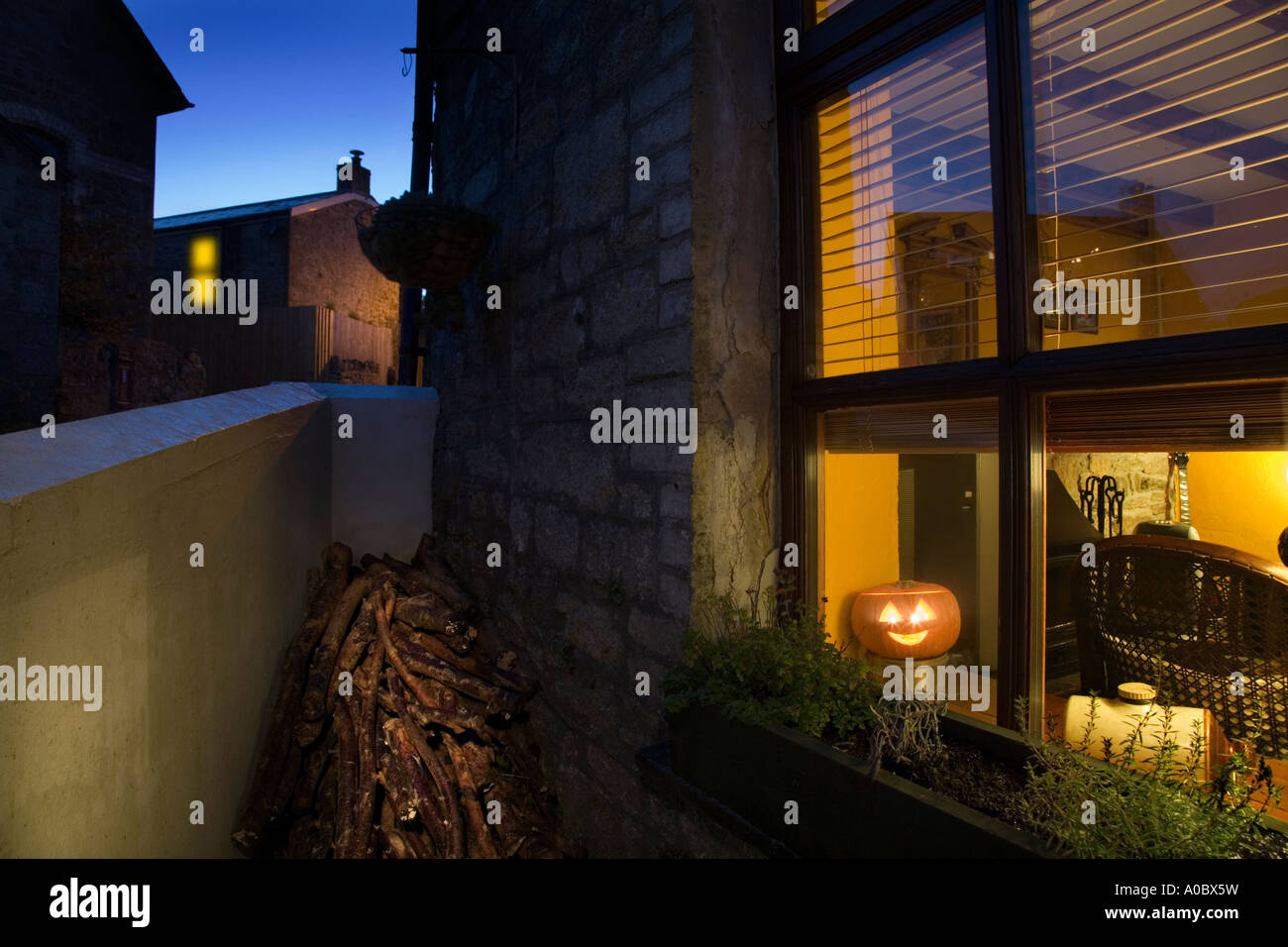 Halloween pumpkin in cottage window Stock Photo