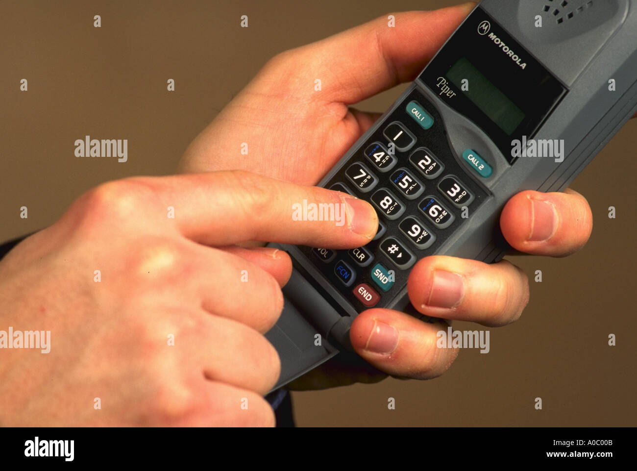 Hand dialing cellphone stock photo alamy