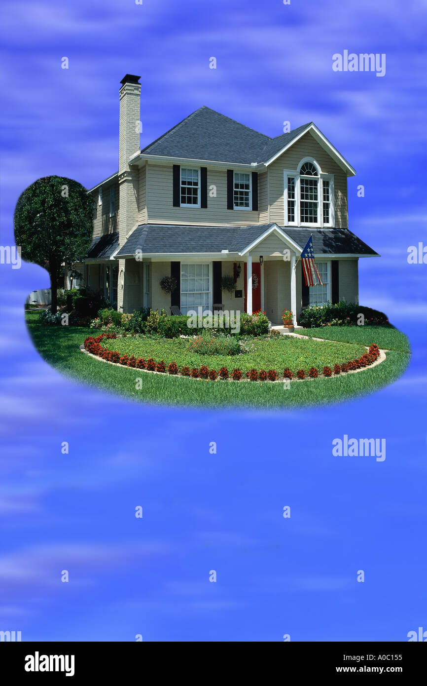 Residential home floating in sky Stock Photo
